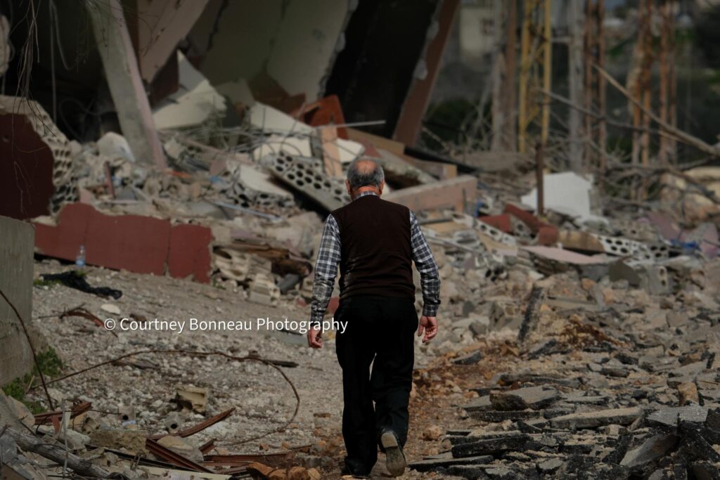 Man among rubble in Lebanon, Photo: Courtney Bonneau Photography